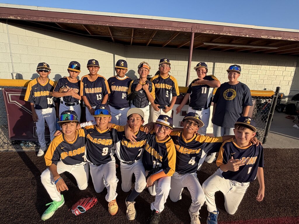 Group photo of the EKIS 7th-grade baseball team members before a game.