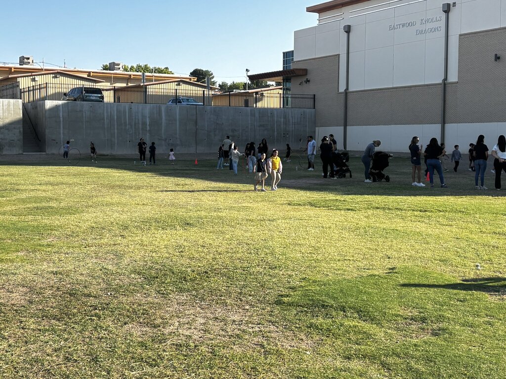 Photo of EKIS students participating a a Wellness Walk with their family members.
