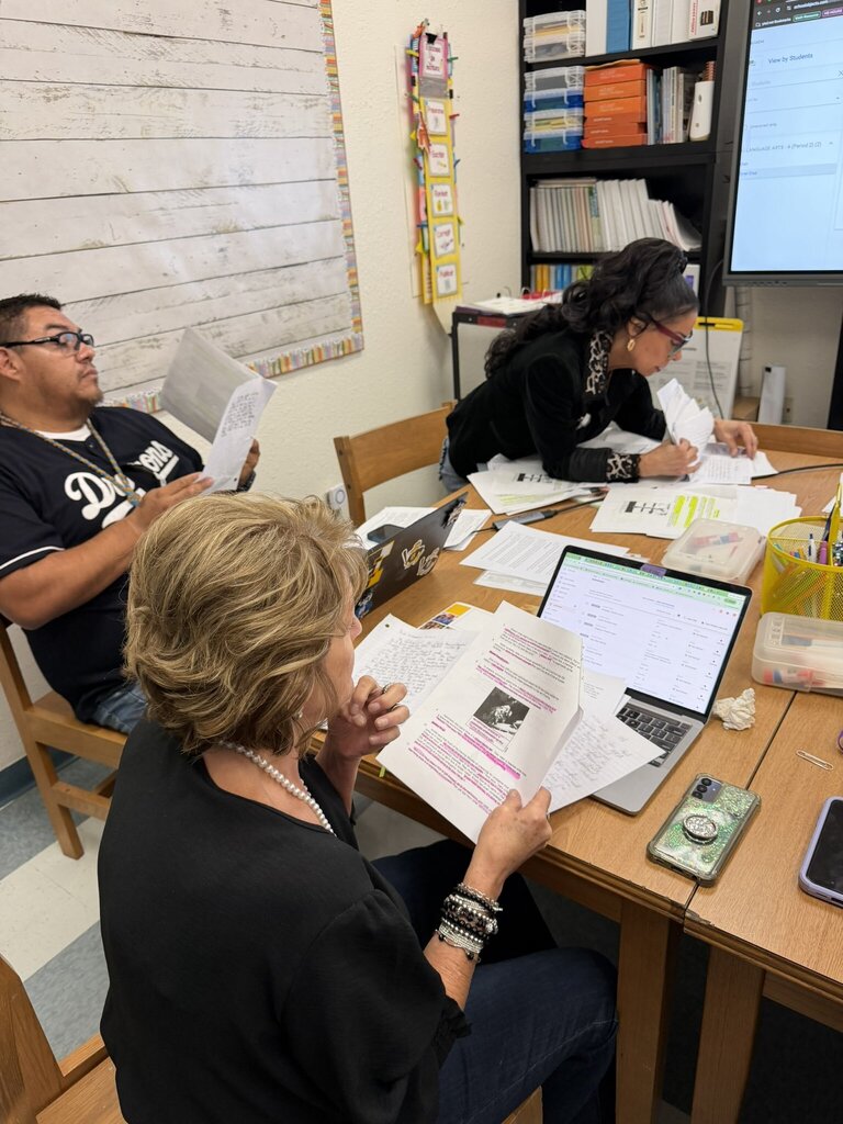 Photo of EKIS ELAR teachers meeting during PLT to review and analyze student responses to identify needs and plan for supporting each student.