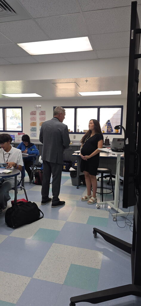Photo of Mr. Dwyer visiting a classroom at EKIS.