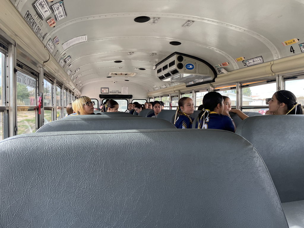 Photo of EKIS 7th and 8th-grade volleyball players on the bus heading to their game against YMS.