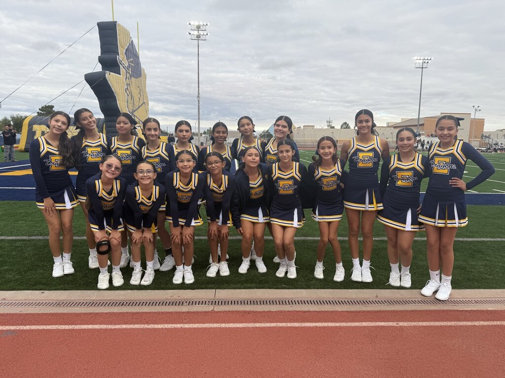 Photo of EKIS cheerleaders at a football game.