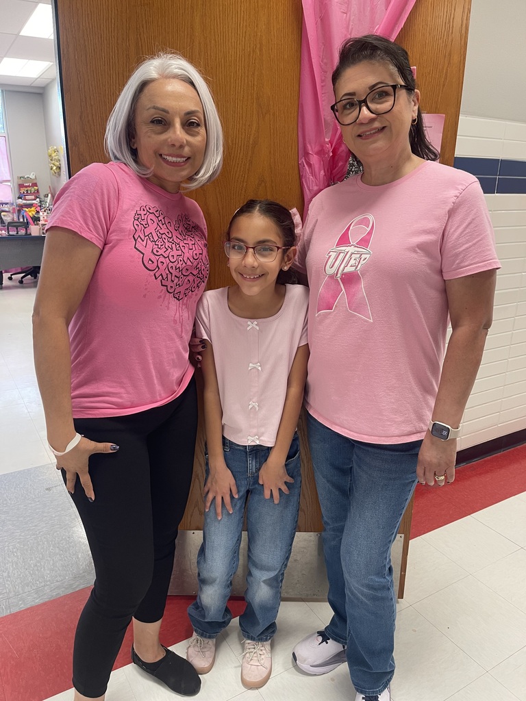 Teachers and student wearing pink in support of breast cancer awareness.