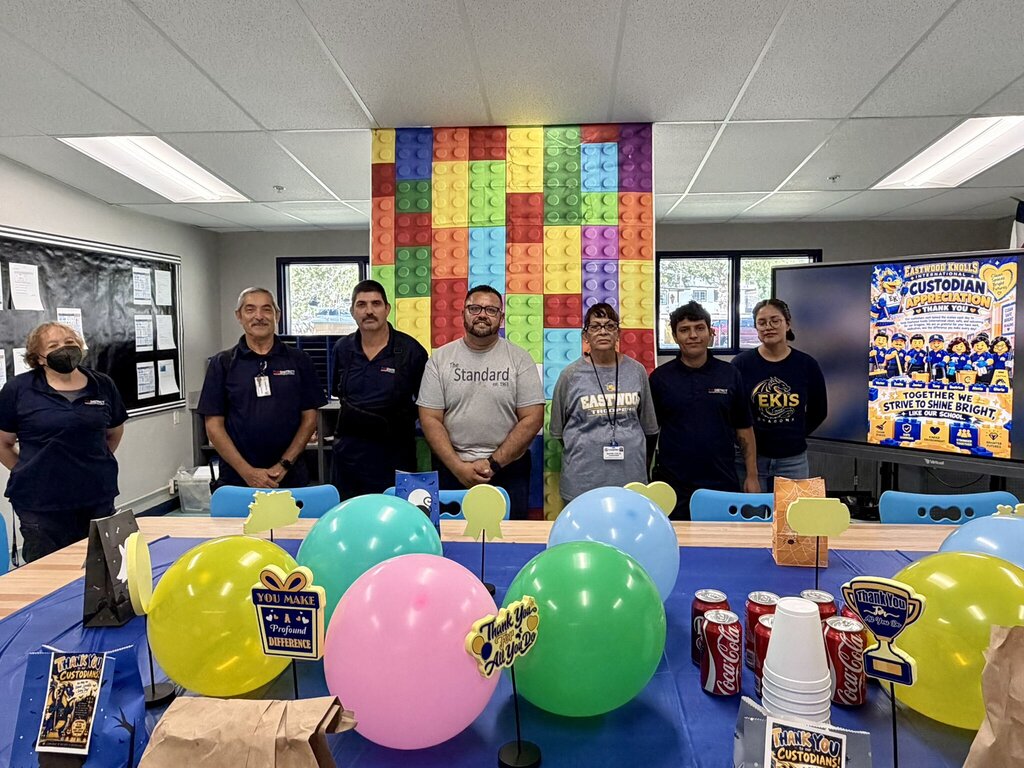 Photo of the EKIS custodial staff being recognized by the EKIS staff and administration for their hard work.