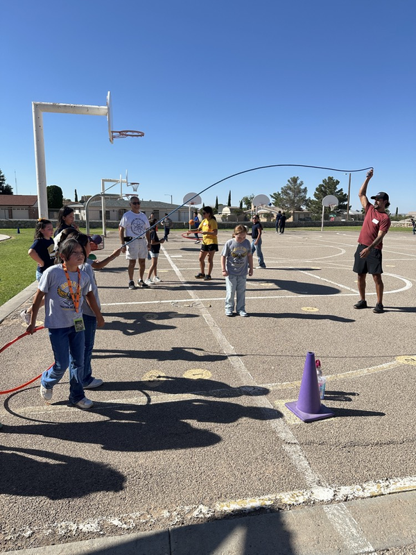 families playing jump rope