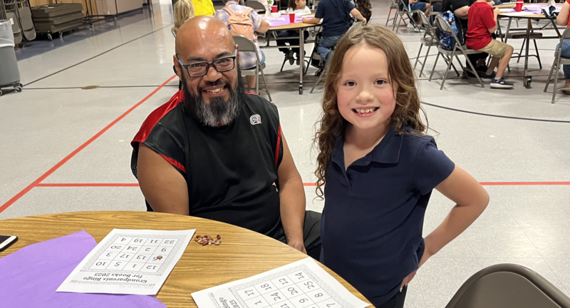 Student with grandpa at celebration