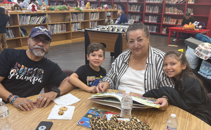 grandparents reading with their grandchild