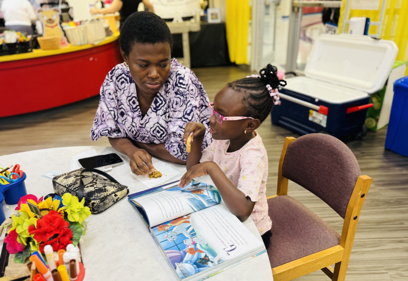 grandparents reading with their grandchild
