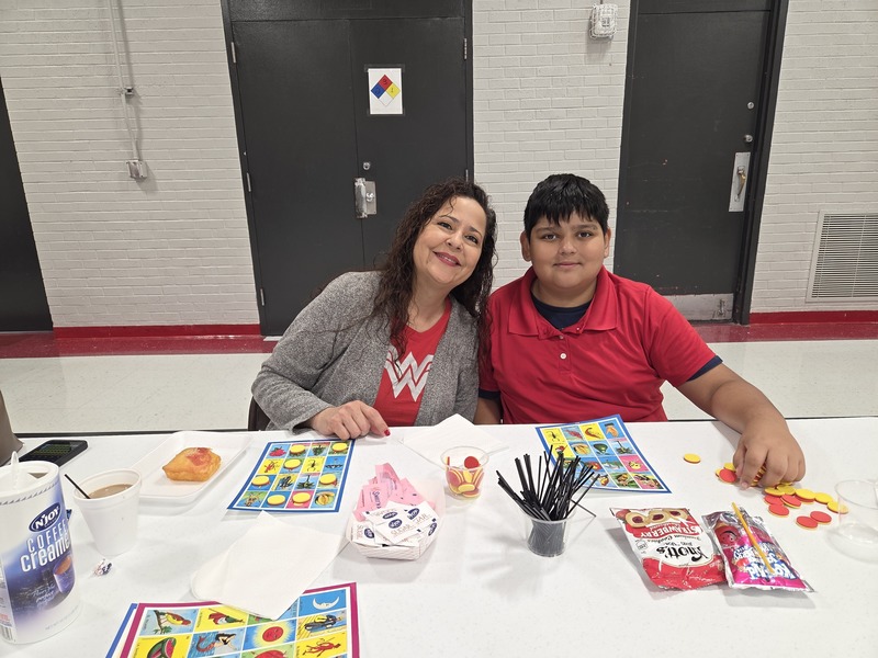5th grader and his Grandma getting ready to play Loteria