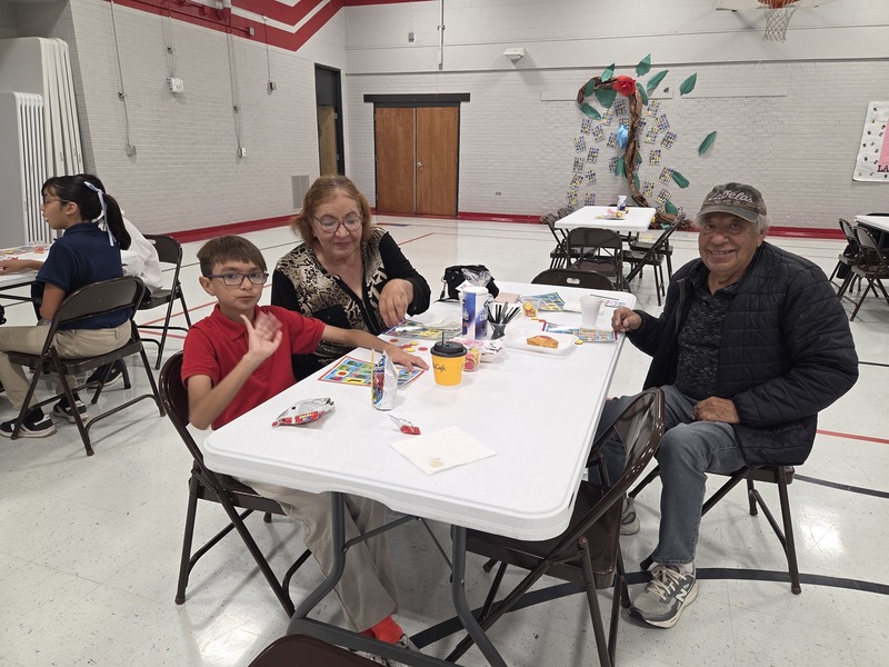 5th grader and Grandparents getting ready to play Loteria