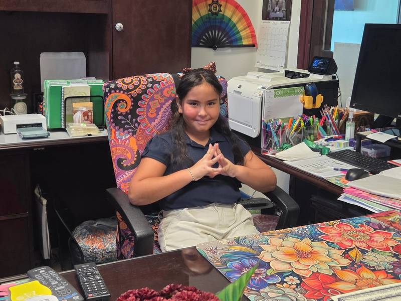 Presa student sits in Lily Limon's office chair