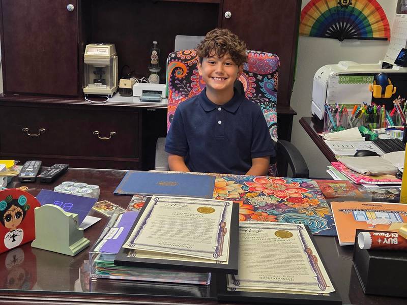 Presa student sits in Lily Limon's office chair
