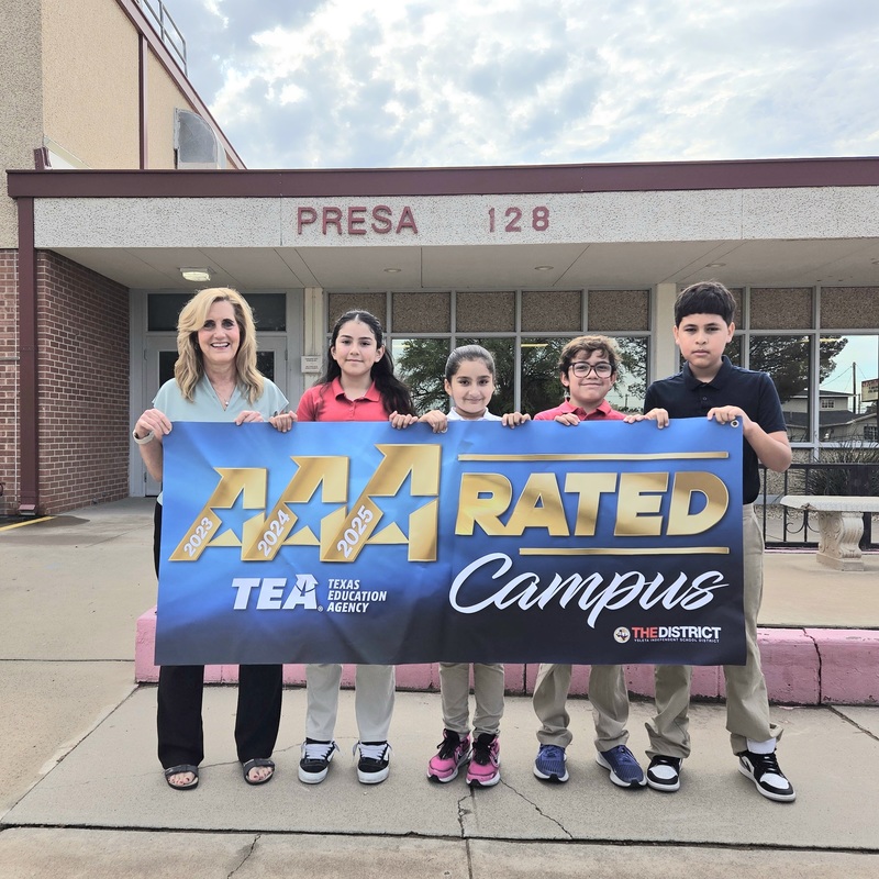 Principal Banegas with students holding the A-rated campus poster for the 3rd consecutive year