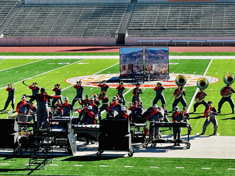 Picture of the Ysleta Band performing in the field at SAC II