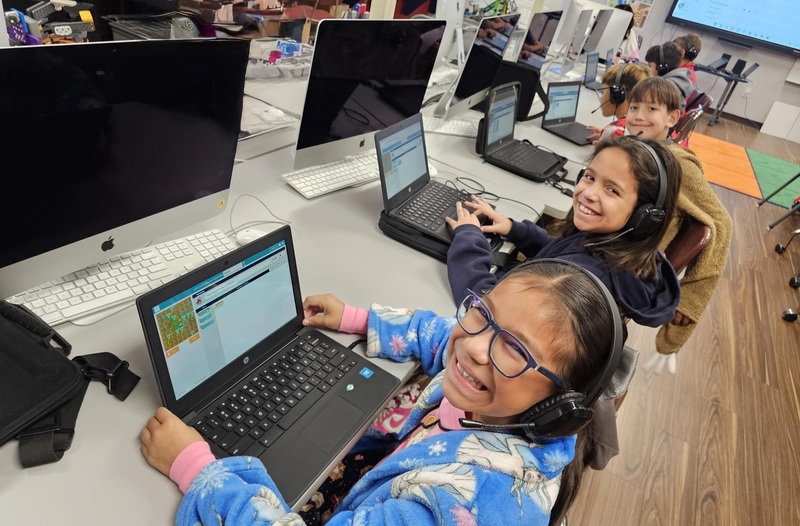 4th graders showing off their coding skills in their pajamas