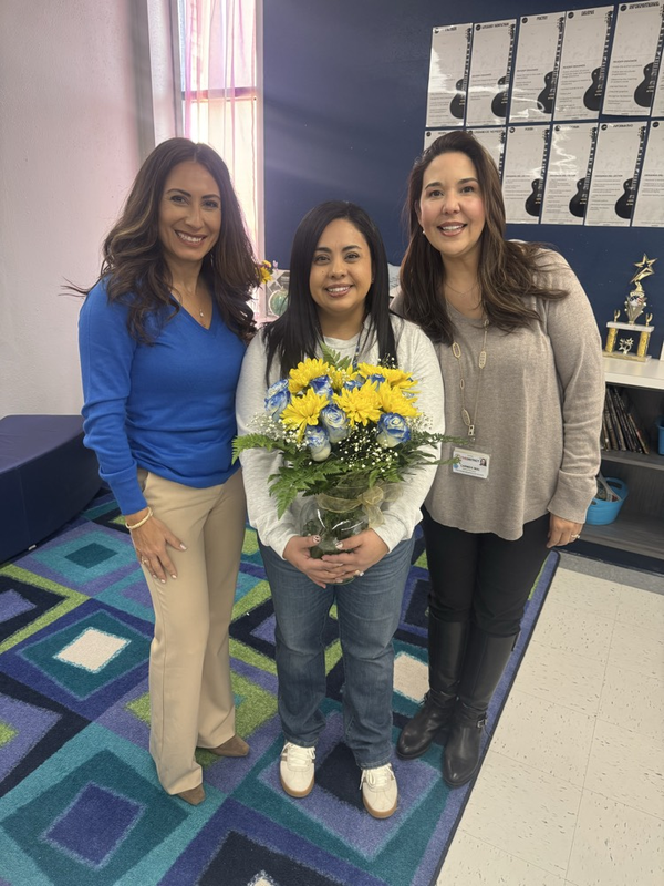 teacher holding flowers