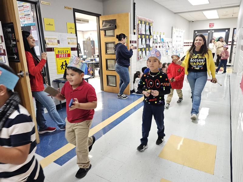 Mrs. Garcia walks with her 1st graders in the 100 day parade