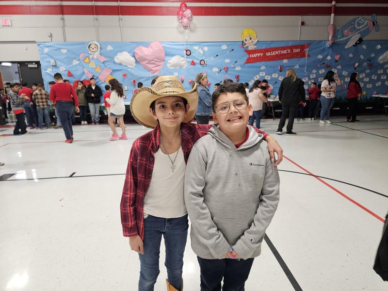 a 4th and 3rd grader boys pose for a quick pic