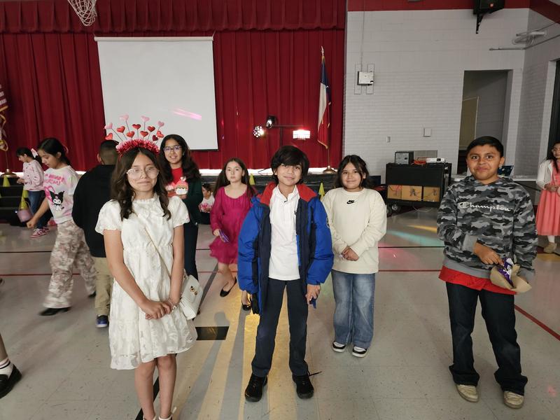 5th graders pose for a quick pic while on the dance floor