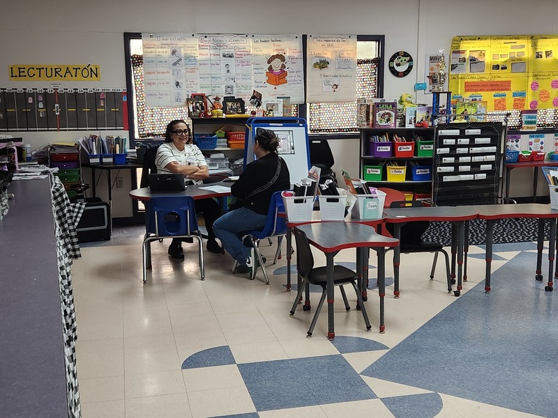 Teacher conferencing with parent and student