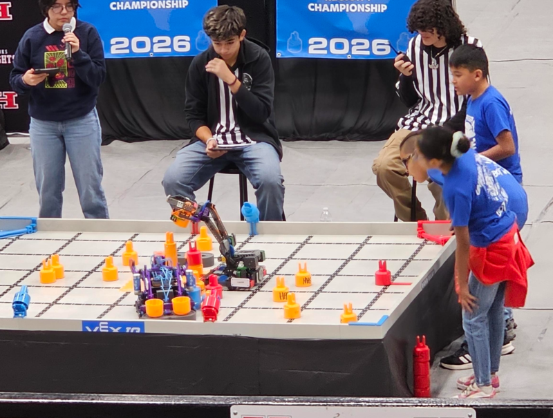 Team B working to get pins stacked on the standoff