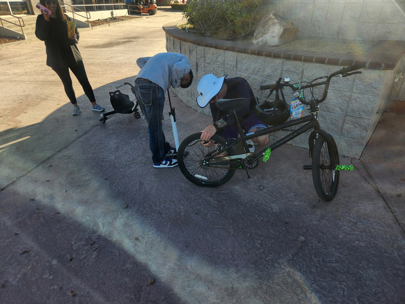 Coach helping with a bike