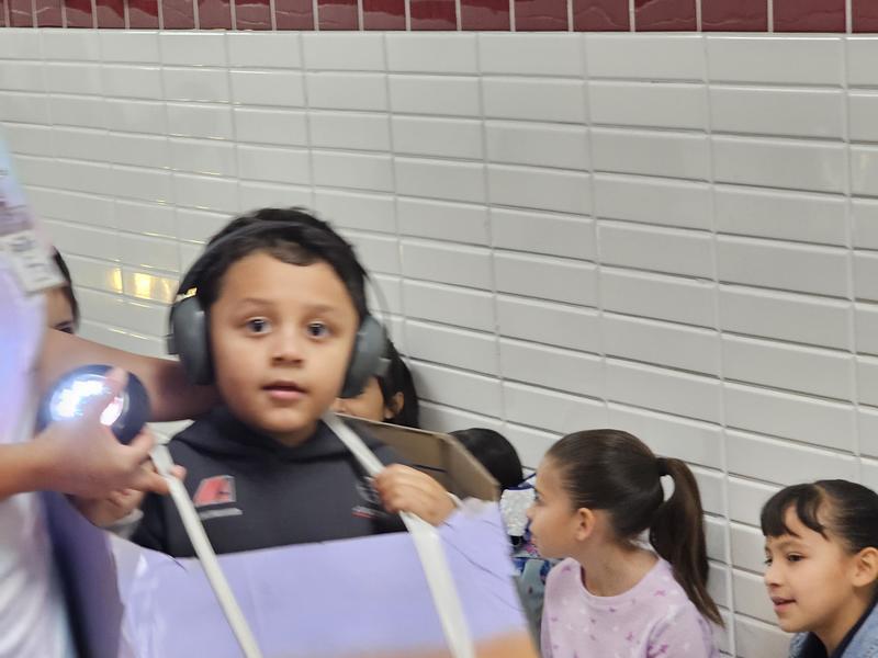 Our PK student shows off his purple transportation car