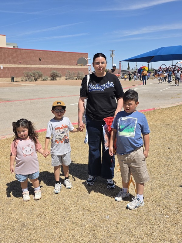 Mom and her three young children pose for a photo