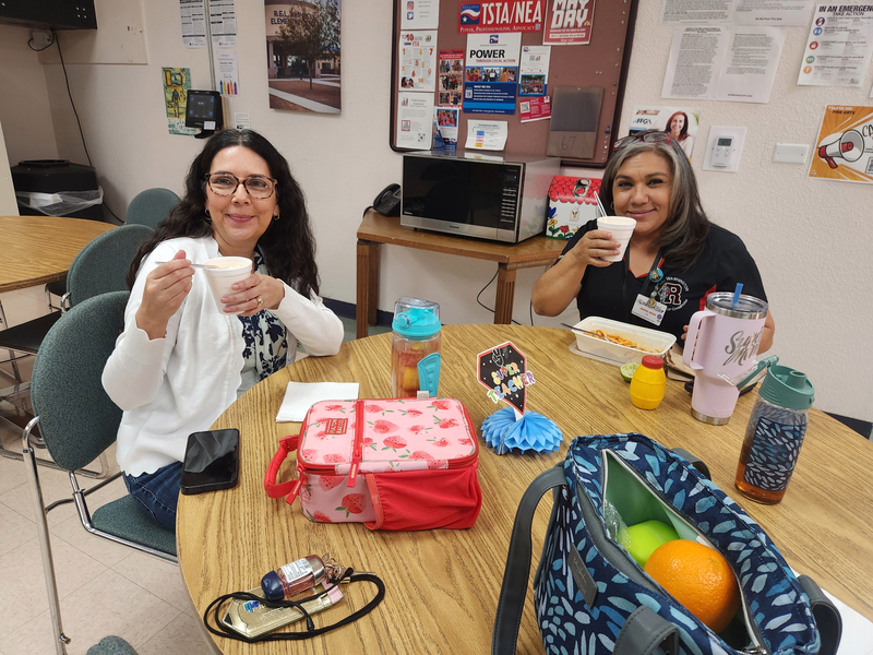 Ms. Olsen and Ms. Santos enjoying their corn in a cup during lunch