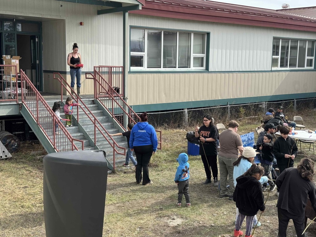 Adults and students at school cookout