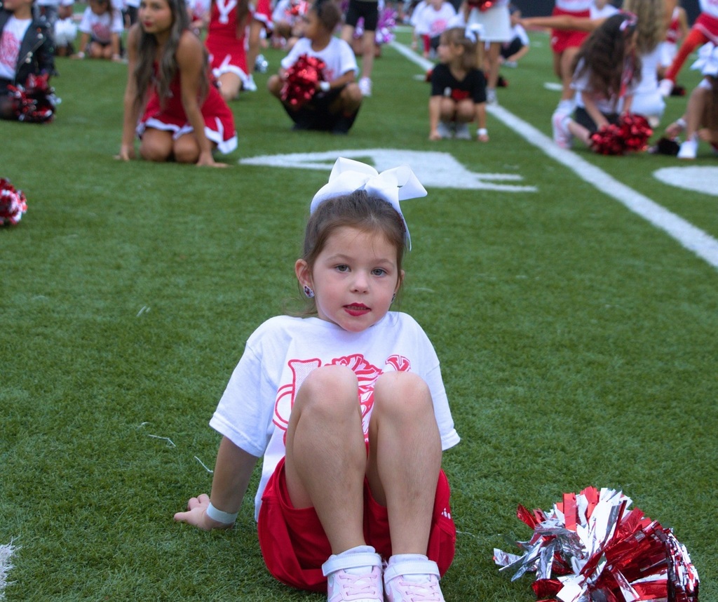 Student cheering on the football field