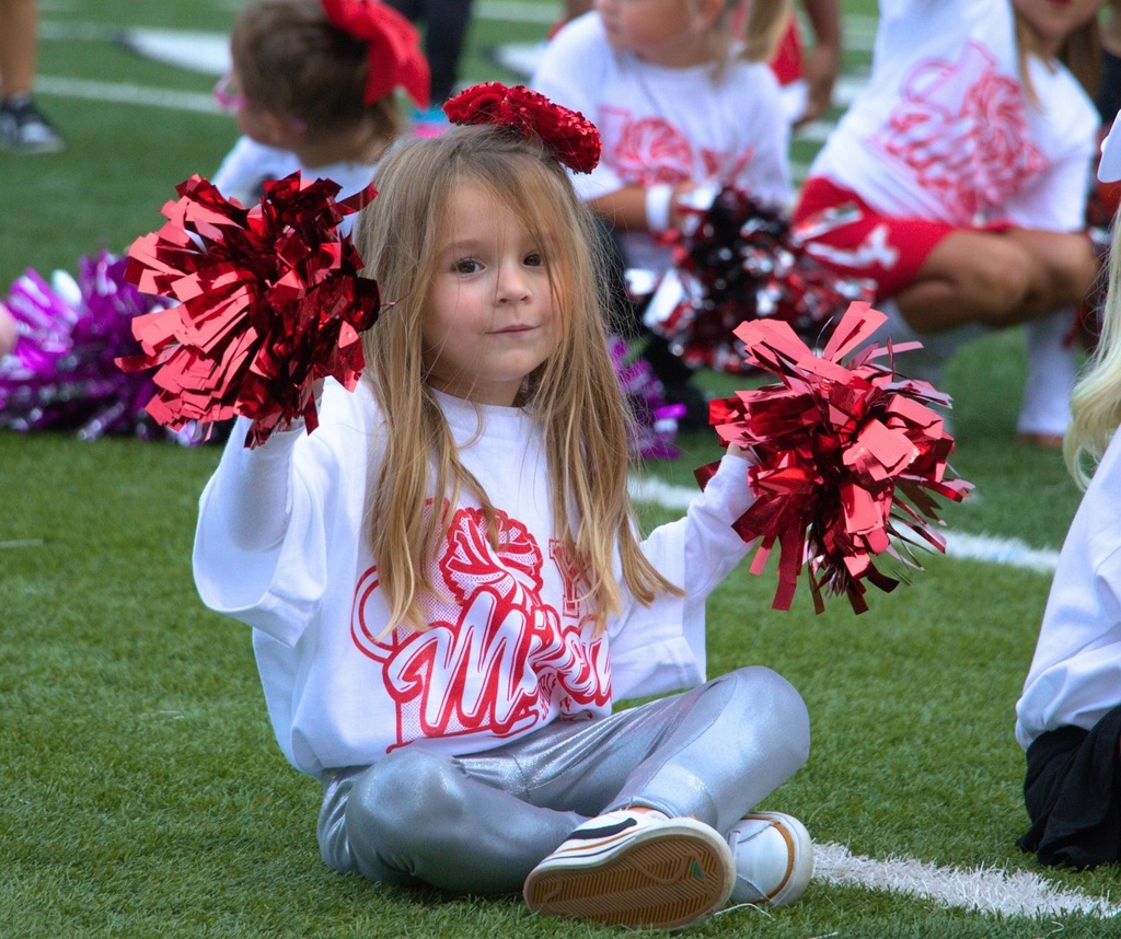 Student cheering on the football field