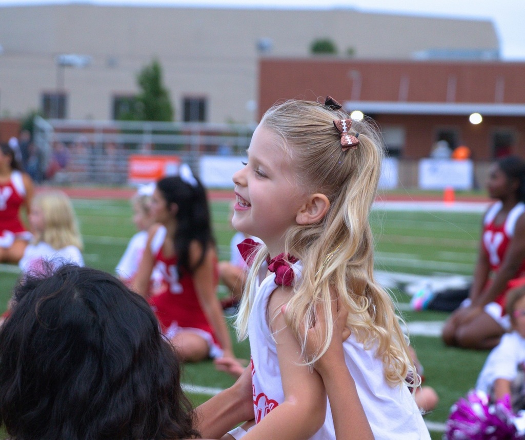 Student cheering on the football field