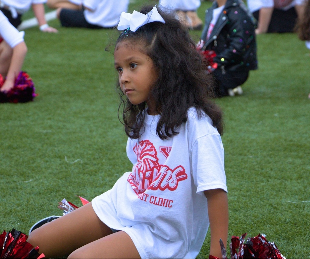 Student cheering on the football field