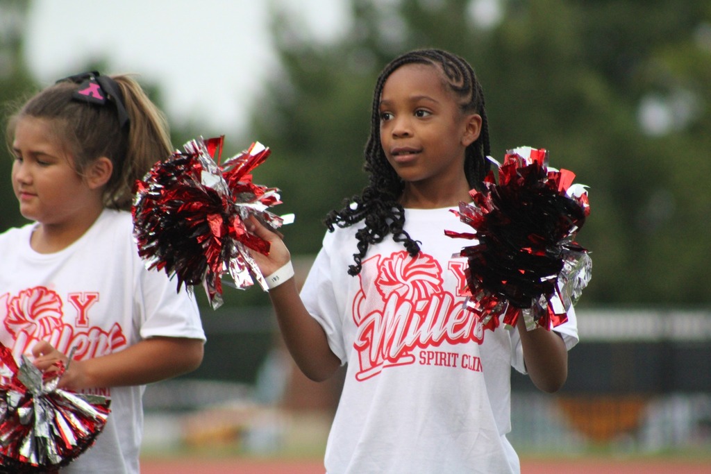 Student cheering on the football field