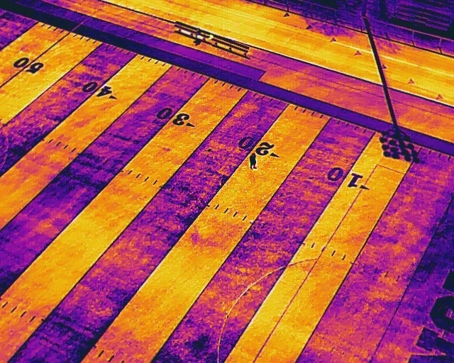 Drone thermal image of Zane Trace football field featuring a person too