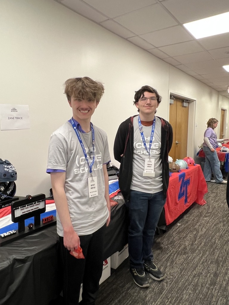 Code Scholar Participants manning the table to explain the projects to anyone stopping  by.